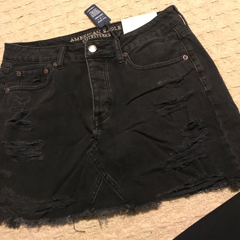 Black denim distressed mini skirt
